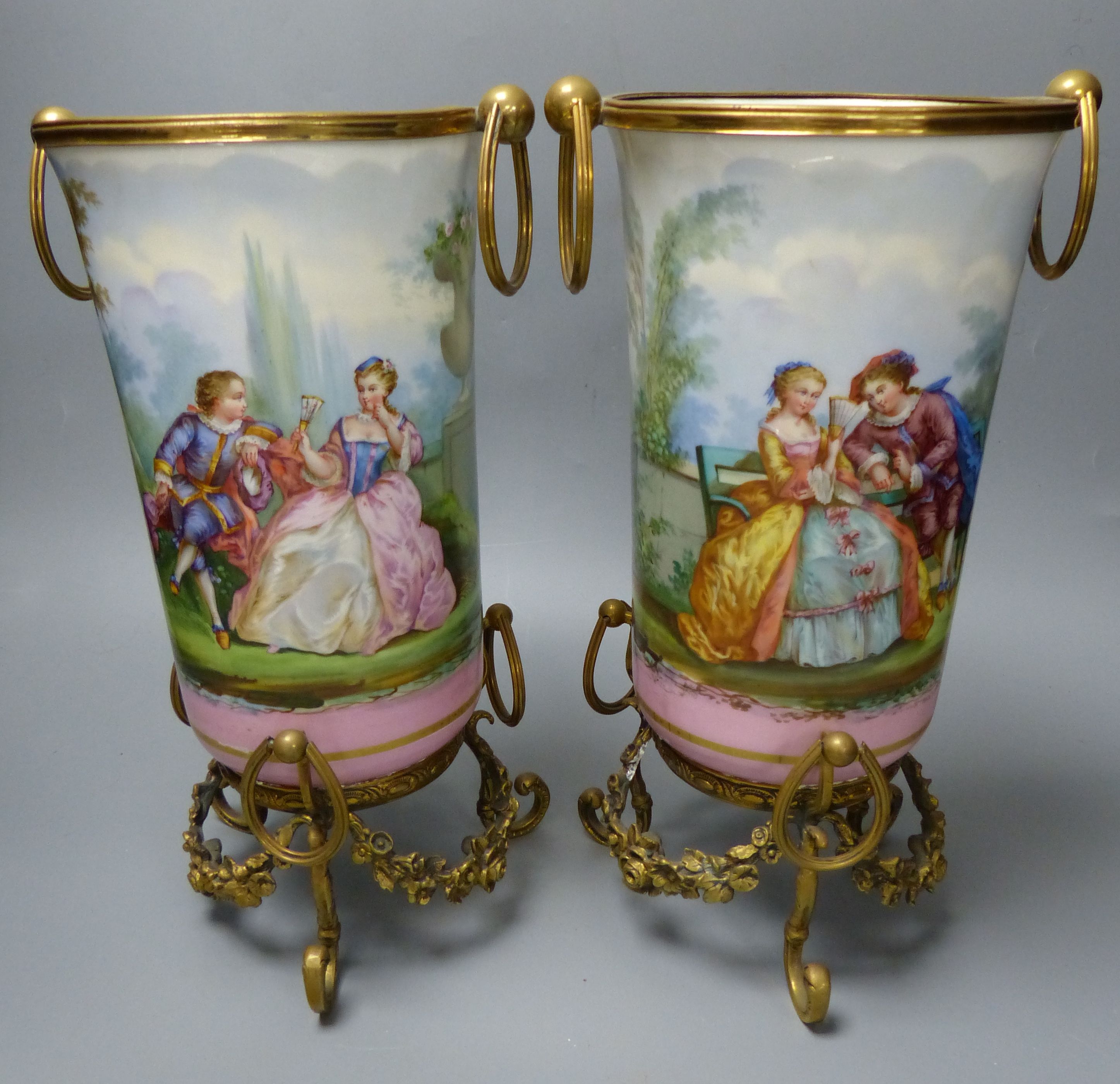 A pair of late 19th century Paris porcelain and gilt metal mounted vases, height 33cm
